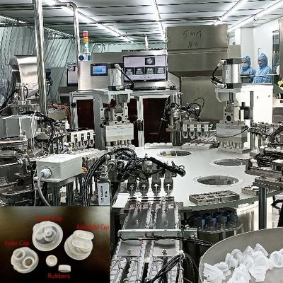 Machine d'assemblage à double couvercle de bouteille de perfusion de type tourne-disque